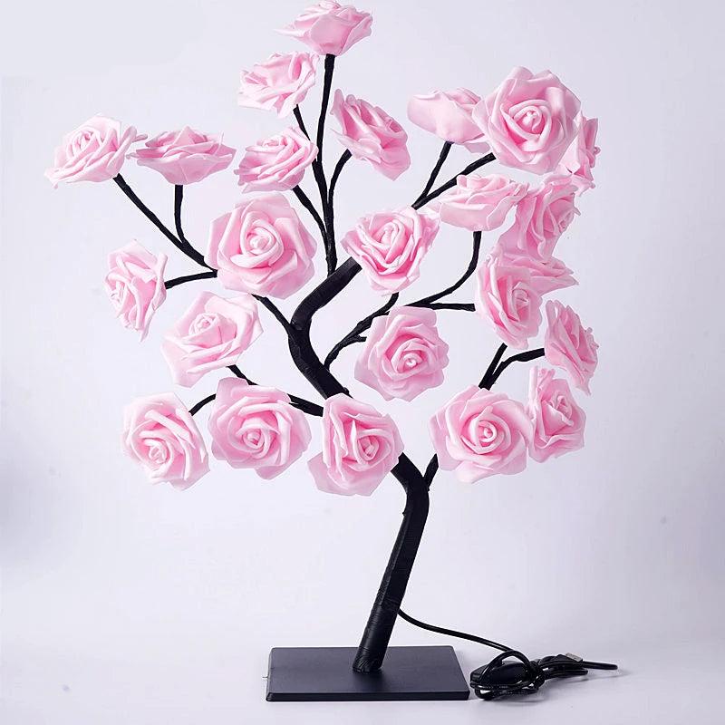 Elegant LED pink rose flower tree lamp with realistic rose blooms on adjustable black branches, set on a sturdy black base, ideal for bedroom, living room, or wedding decor; USB-powered for convenient, energy-efficient lighting, perfect for creating a cozy, romantic ambiance in home interiors