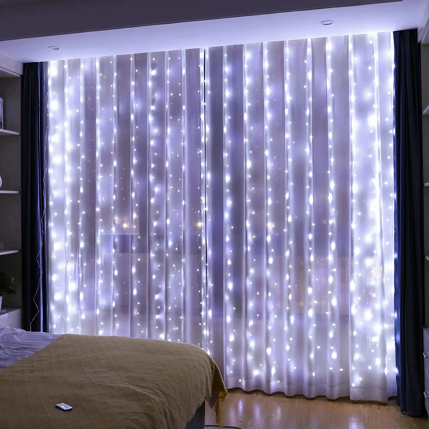 Elegant curtain of white LED string lights illuminating a bedroom, creating a soft and dreamy ambiance. The lights are arranged vertically, cascading down sheer curtains, adding a warm, inviting glow to the space. Perfect for cozy bedroom decor or creating a magical, festive atmosphere.
