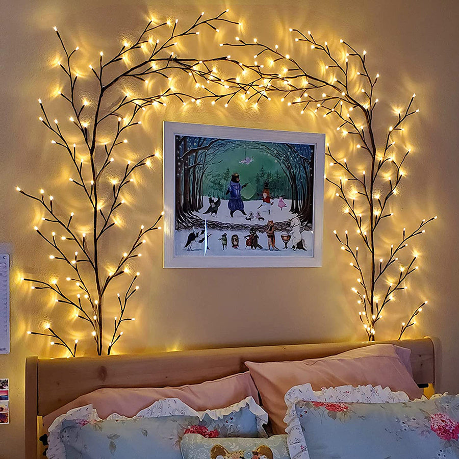 Cozy bedroom with warm LED branch lights framing artwork above bed. Ambient lighting creates a magical, relaxing atmosphere, enhancing the bedroom decor with a fairy-tale vibe. Perfect for boho or nature-inspired bedroom themes, this wall decor features branch-style light fixtures that add warmth and charm to the space.