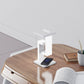 Modern minimalist LED table lamp with wireless charging, perfect for desks or bedside tables. It combines elegant design with practicality, featuring a sleek form and functional charging base ideal for contemporary spaces.