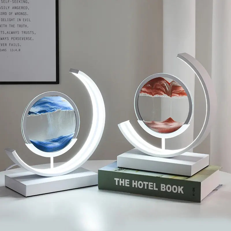 Modern LED sand art lamp featuring a circular design with dynamic sandscape, creating a mesmerizing flow effect. Available in blue and red variations, it serves as both a decorative piece and a calming light source, perfect for living room or office decor.